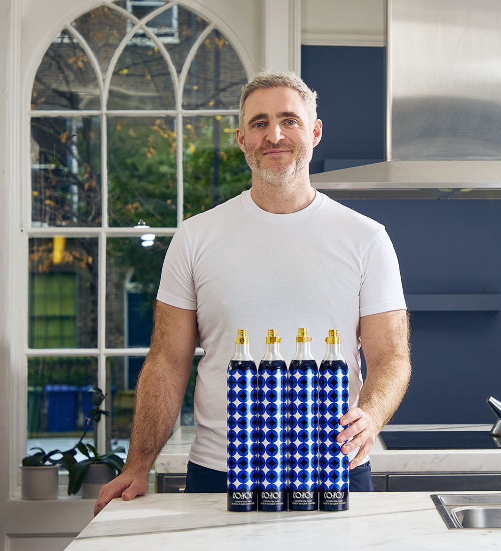Marcus O’Donovan holding CO2 YOU cylinders